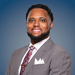 A Black man in a suit.